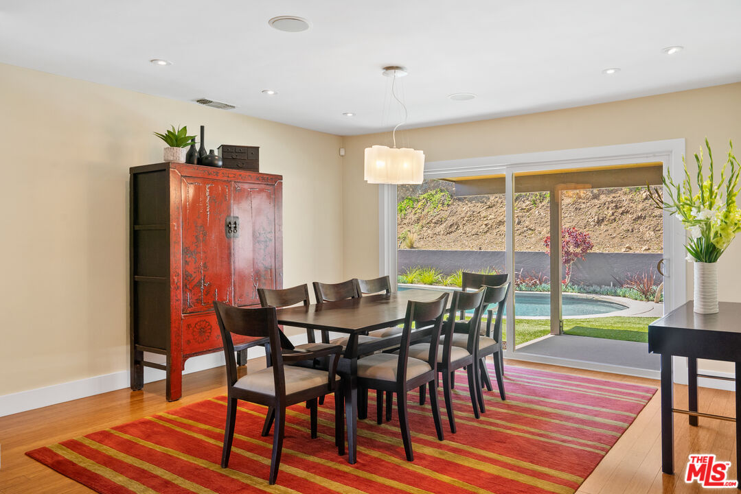 2137 Banyan Drive Los Angeles, CA 90049 - Photo 11 of 39 a view of a dining room with furniture window and wooden floor