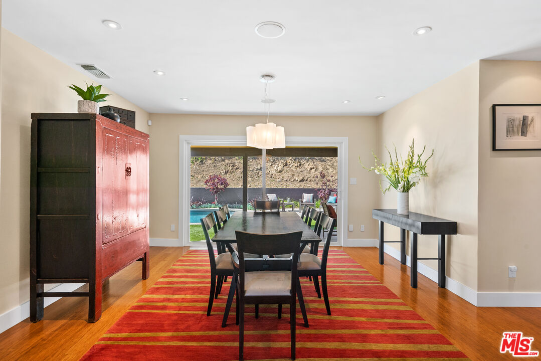 2137 Banyan Drive Los Angeles, CA 90049 - Photo 12 of 39 a view of a dining room with furniture window and wooden floor
