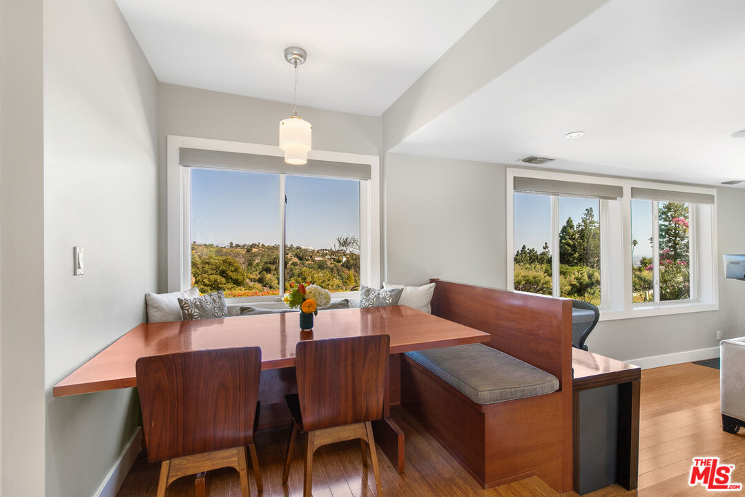 2137 Banyan Drive Los Angeles, CA 90049 - Photo 16 of 39 a view of a dining room with furniture window and outside view
