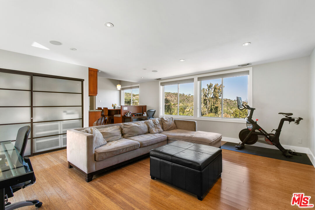 2137 Banyan Drive Los Angeles, CA 90049 - Photo 17 of 39 a living room with furniture and a large window