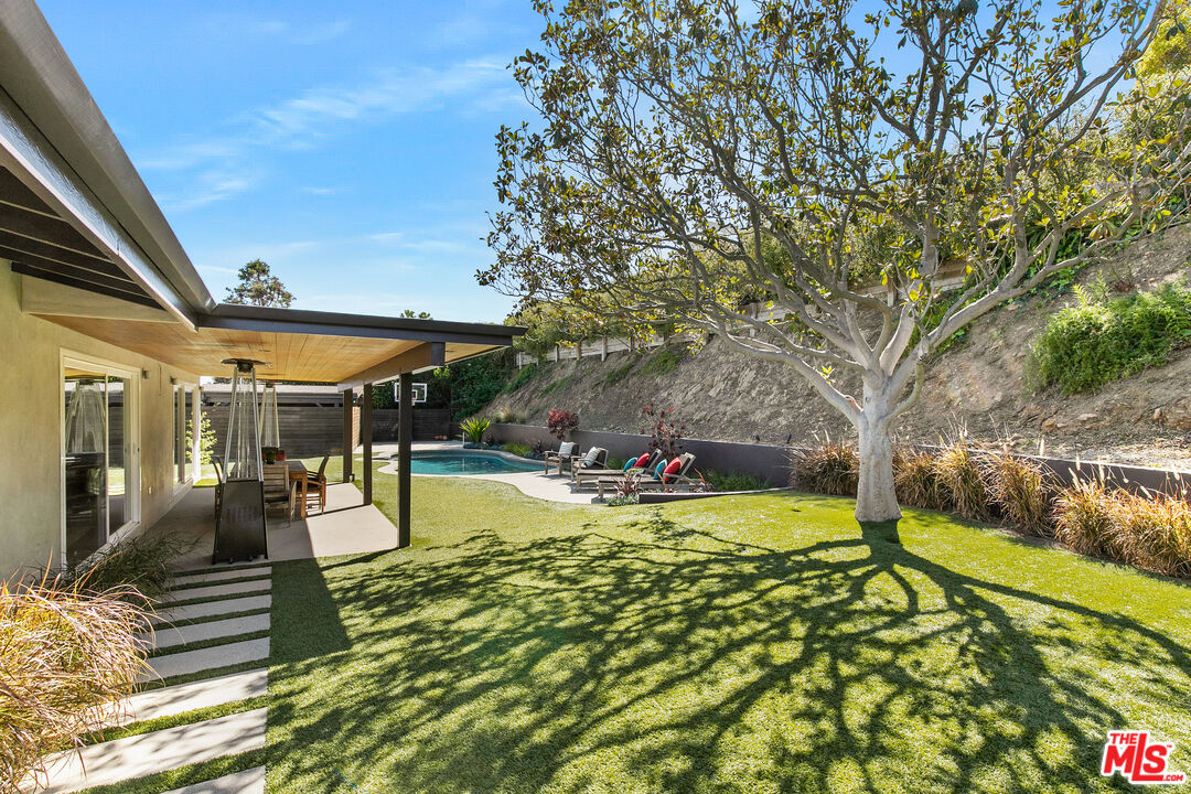 2137 Banyan Drive Los Angeles, CA 90049 - Photo 27 of 39 a view of swimming pool with a patio
