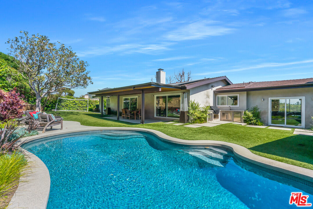 2137 Banyan Drive Los Angeles, CA 90049 - Photo 30 of 39 a front view of a house with swimming pool having outdoor seating