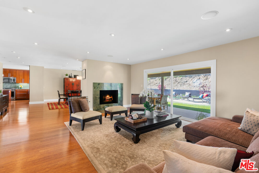 2137 Banyan Drive Los Angeles, CA 90049 - Photo 7 of 39 a living room with furniture and a fireplace