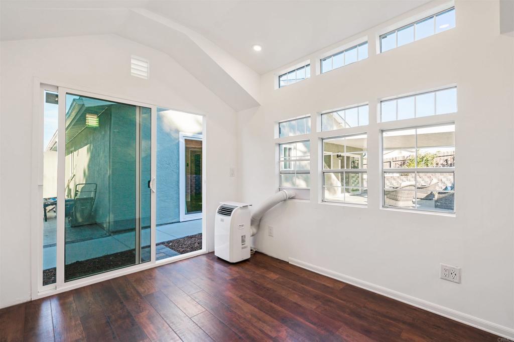 4435 Springtime Drive Oceanside, CA 92056 - Photo 11 of 22 a view of a room with wooden floor and windows