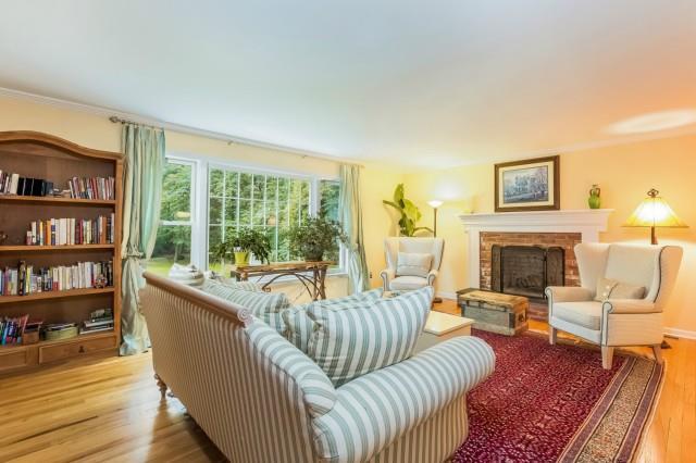 25 Osborn Farm Road Weston, CT 06883 - Photo 1 of 1 a living room with furniture and a fireplace