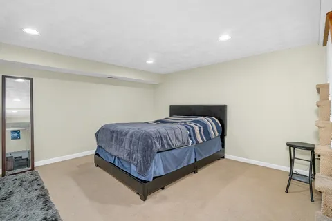 a bedroom with a bed and a table in it
