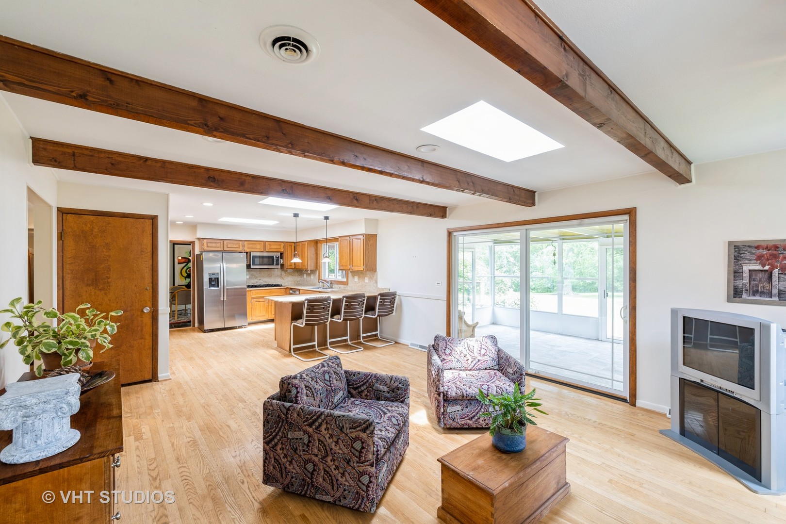 855 Beverly Place Lake Forest, IL 60045 - Photo 6 of 21 a living room with furniture fireplace and a large window