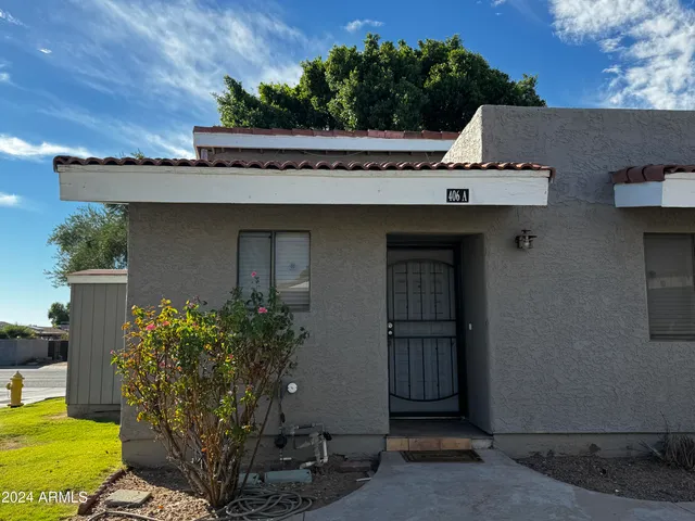 a view of a house with a potted plant