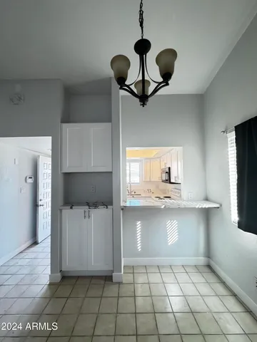 a kitchen with a cabinets and window