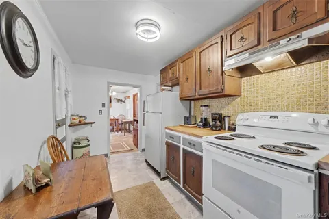 a kitchen with a stove and a refrigerator