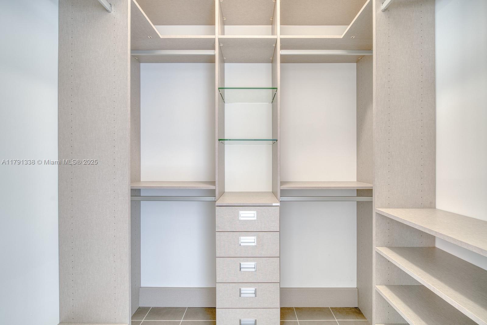 90 Alton Road, Unit TH2 Miami Beach, FL 33139 - Photo 24 of 32 a view of an empty walk in closet