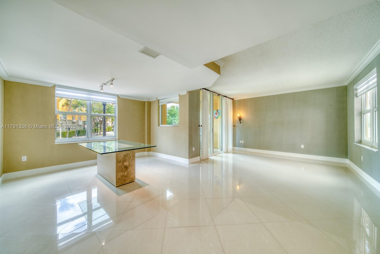 90 Alton Road, Unit TH2 Miami Beach, FL 33139 - Photo 4 of 32 a view of an empty room and window