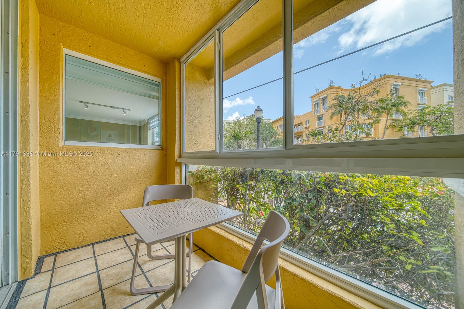 90 Alton Road, Unit TH2 Miami Beach, FL 33139 - Photo 6 of 32 a view of a two chair in the balcony