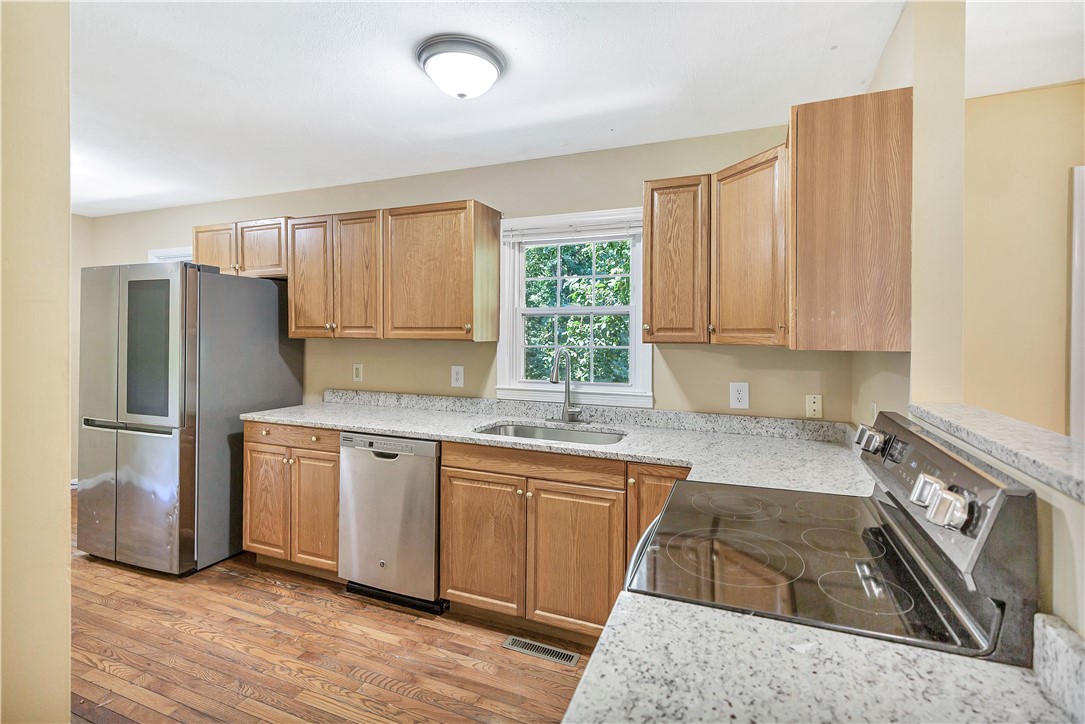 2011 Forest Drive Seneca, SC 29672 - Photo 11 of 36 Culinary delights await in this modern kitchen with ample counter space and wood-grain flooring.