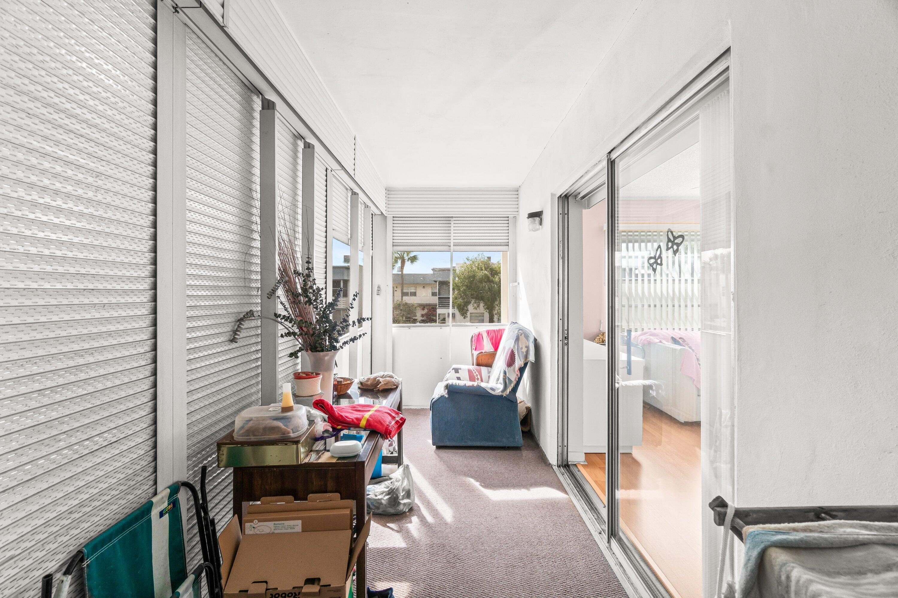 508 Normandy Lane, Unit 508 Delray Beach, FL 33484 - Photo 12 of 25 a living room with furniture and a window