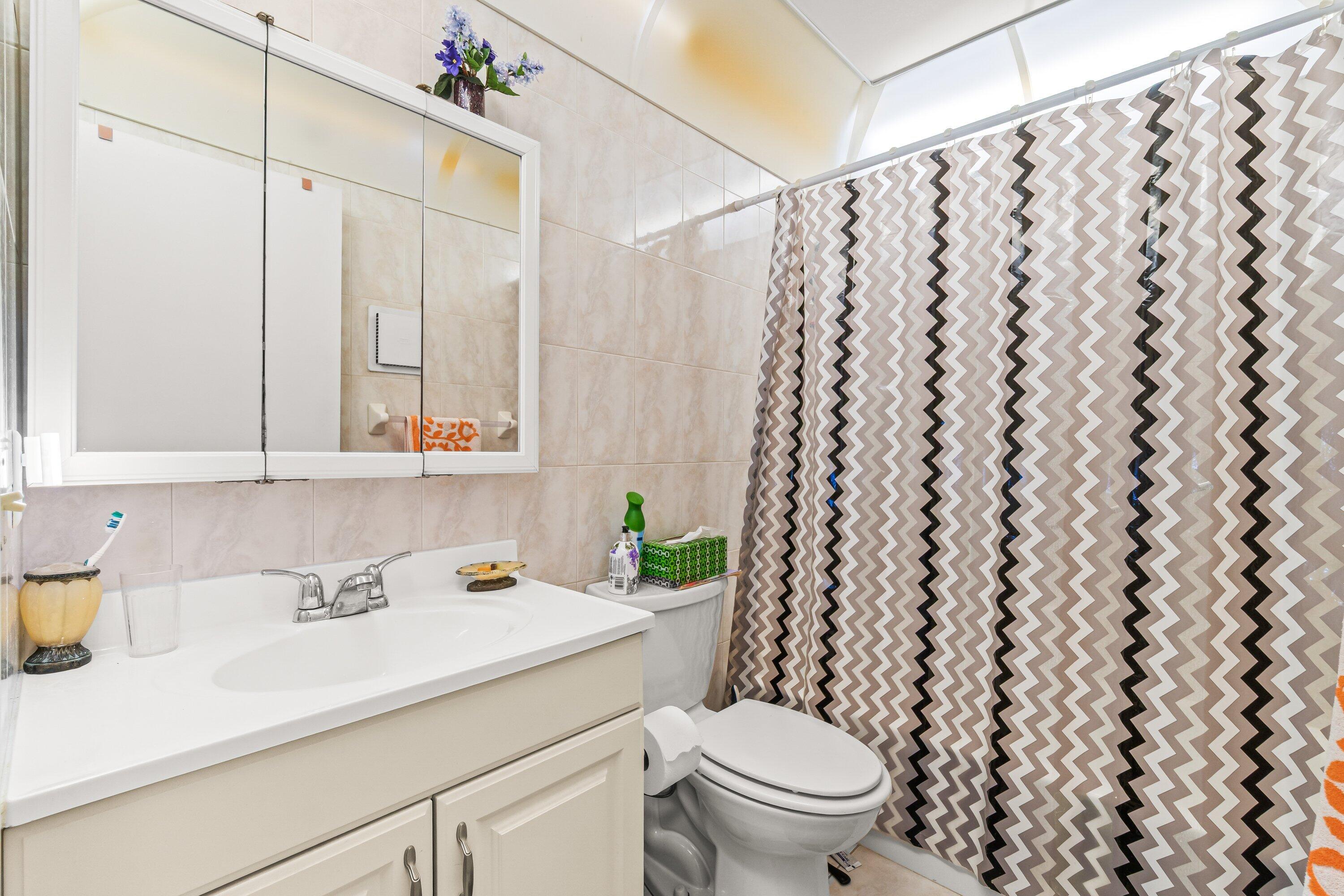 508 Normandy Lane, Unit 508 Delray Beach, FL 33484 - Photo 17 of 25 a bathroom with a sink and a toilet