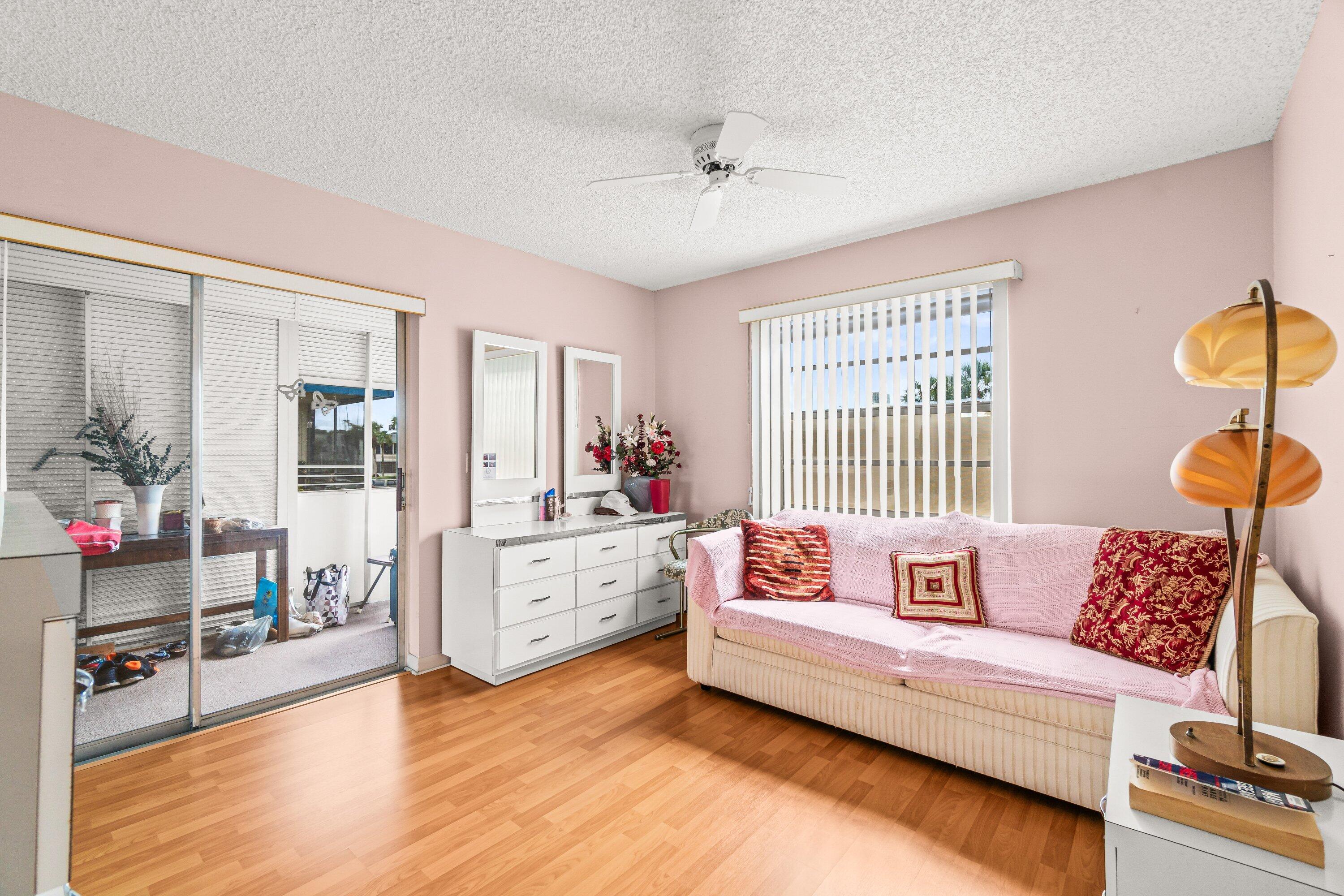 508 Normandy Lane, Unit 508 Delray Beach, FL 33484 - Photo 18 of 25 a living room with furniture and wooden floor