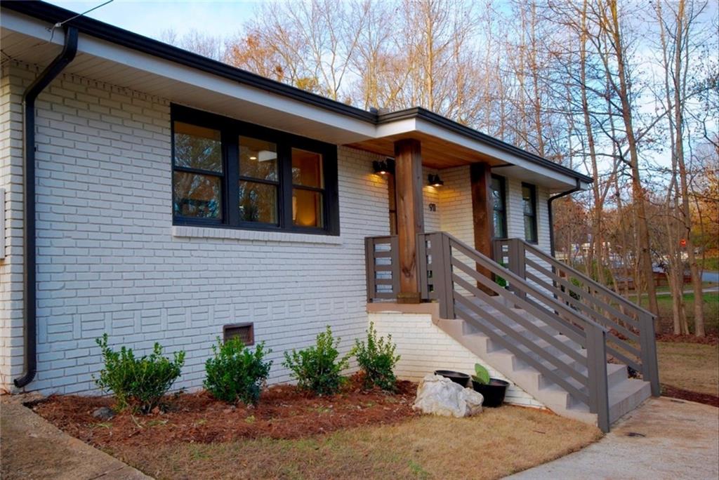 a front view of a house with stairs