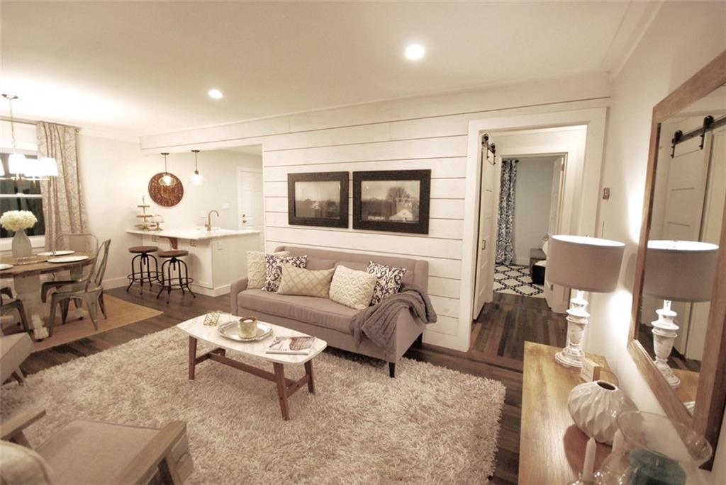 911 Lake Court Smyrna, GA 30082 - Photo 4 of 9 a living room with furniture and a wooden floor