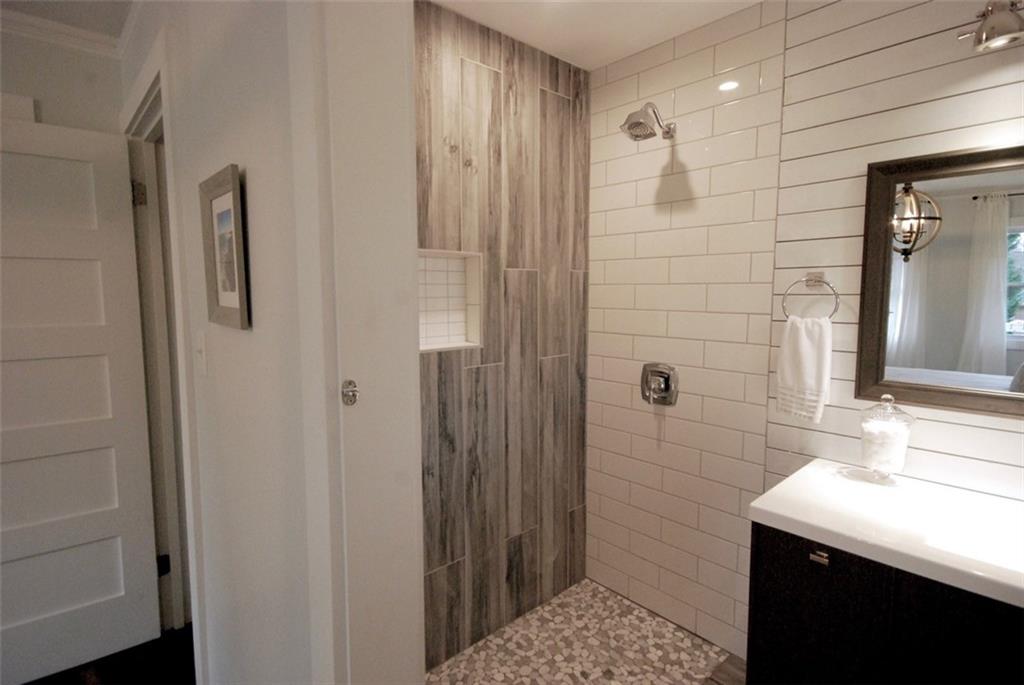 911 Lake Court Smyrna, GA 30082 - Photo 6 of 9 a bathroom with a shower and a sink