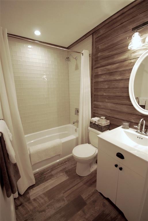 911 Lake Court Smyrna, GA 30082 - Photo 7 of 9 a bathroom with a sink toilet and shower