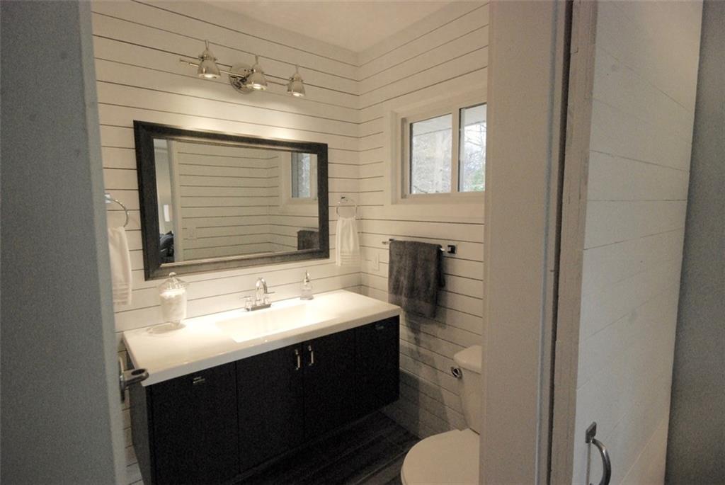 911 Lake Court Smyrna, GA 30082 - Photo 8 of 9 a bathroom with a sink toilet and mirror