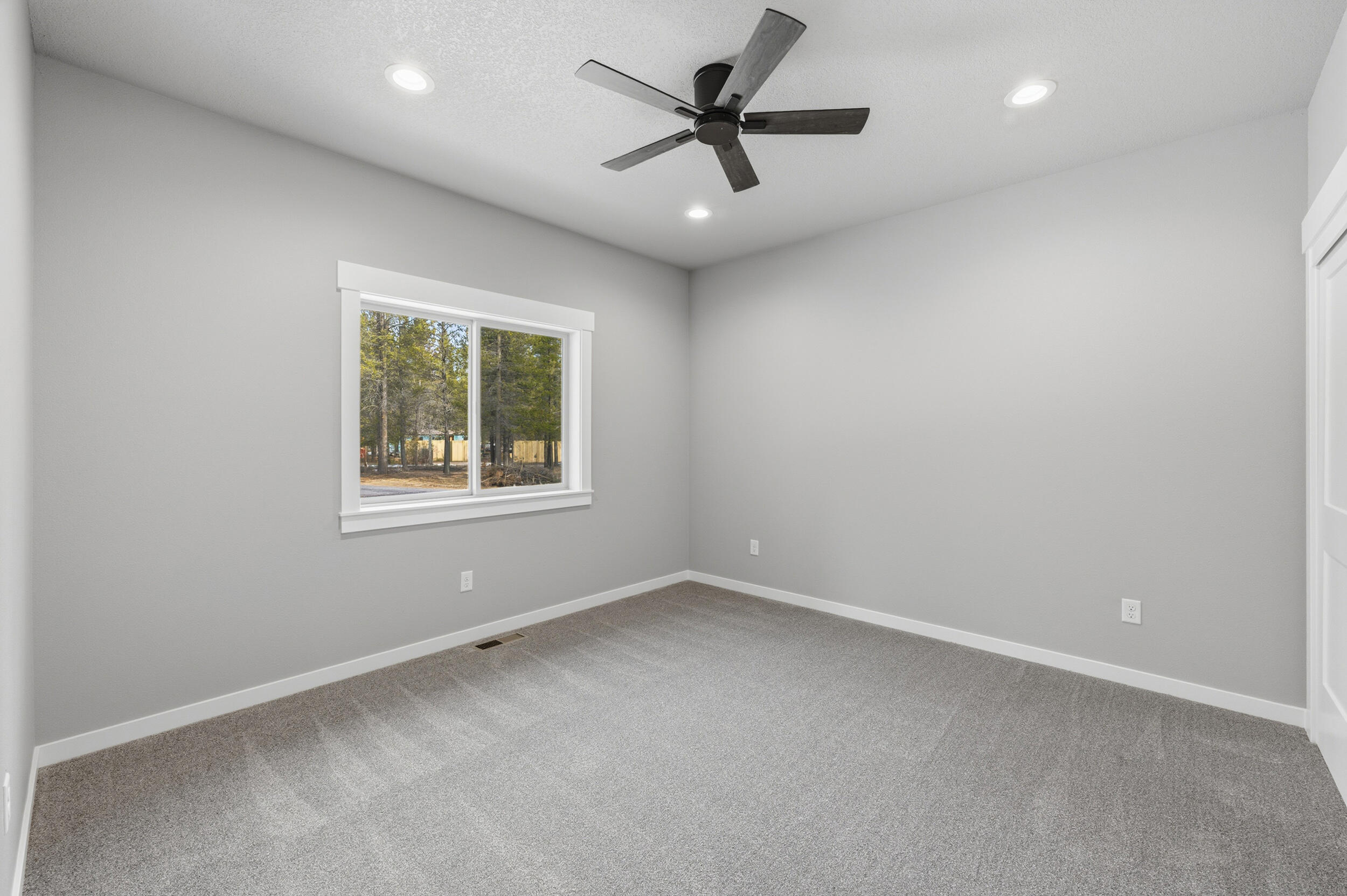 16083 Dyke Road, Unit 9 La Pine, OR 97739 - Photo 34 of 53 an empty room with a window and a fan