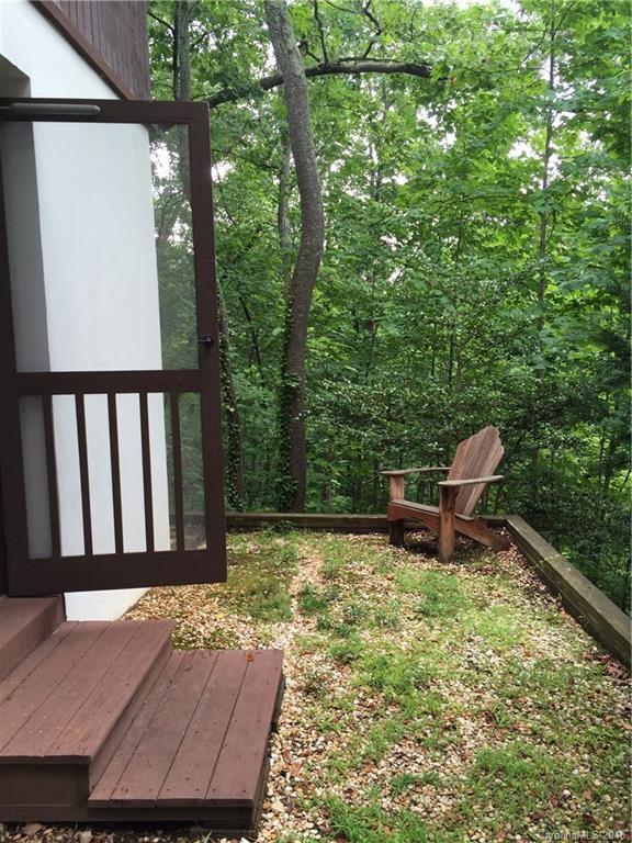 681 Laurel Ridge Road Columbus, NC 28722 - Photo 20 of 24 a view of a two chairs in the roof