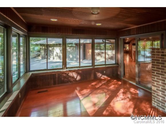681 Laurel Ridge Road Columbus, NC 28722 - Photo 8 of 24 a view of an empty room with a balcony