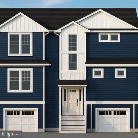 a front view of a house with a garage