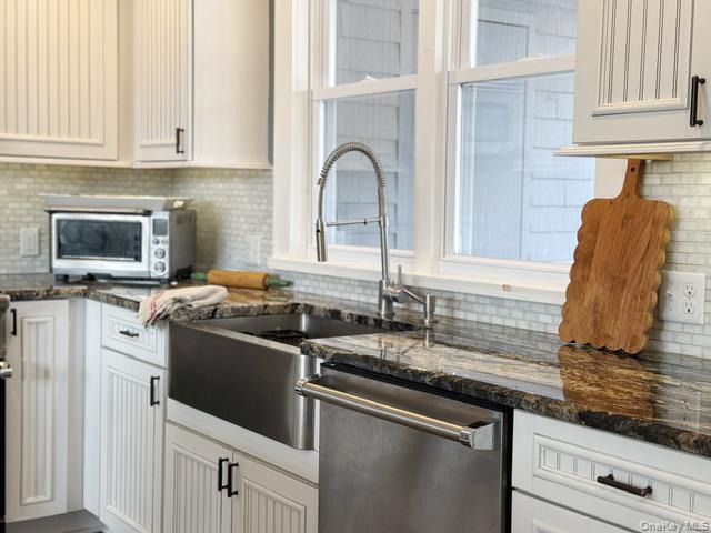 57 Inn Road Forestburgh, NY 12777 - Photo 2 of 49 a kitchen with granite countertop a sink and a stove top oven