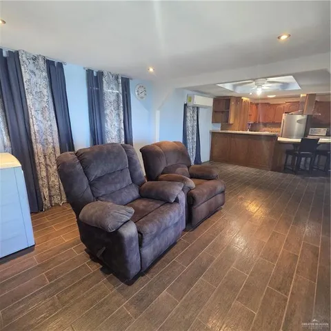 a view of room with window and wooden floor