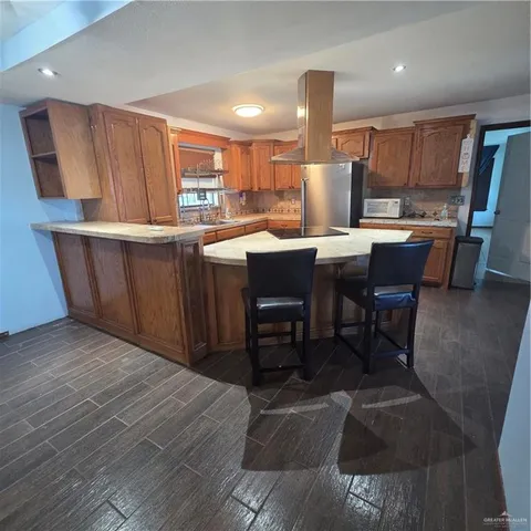 a room with a window and chandelier
