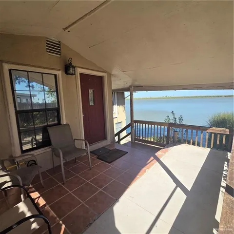 a view of a balcony with chairs