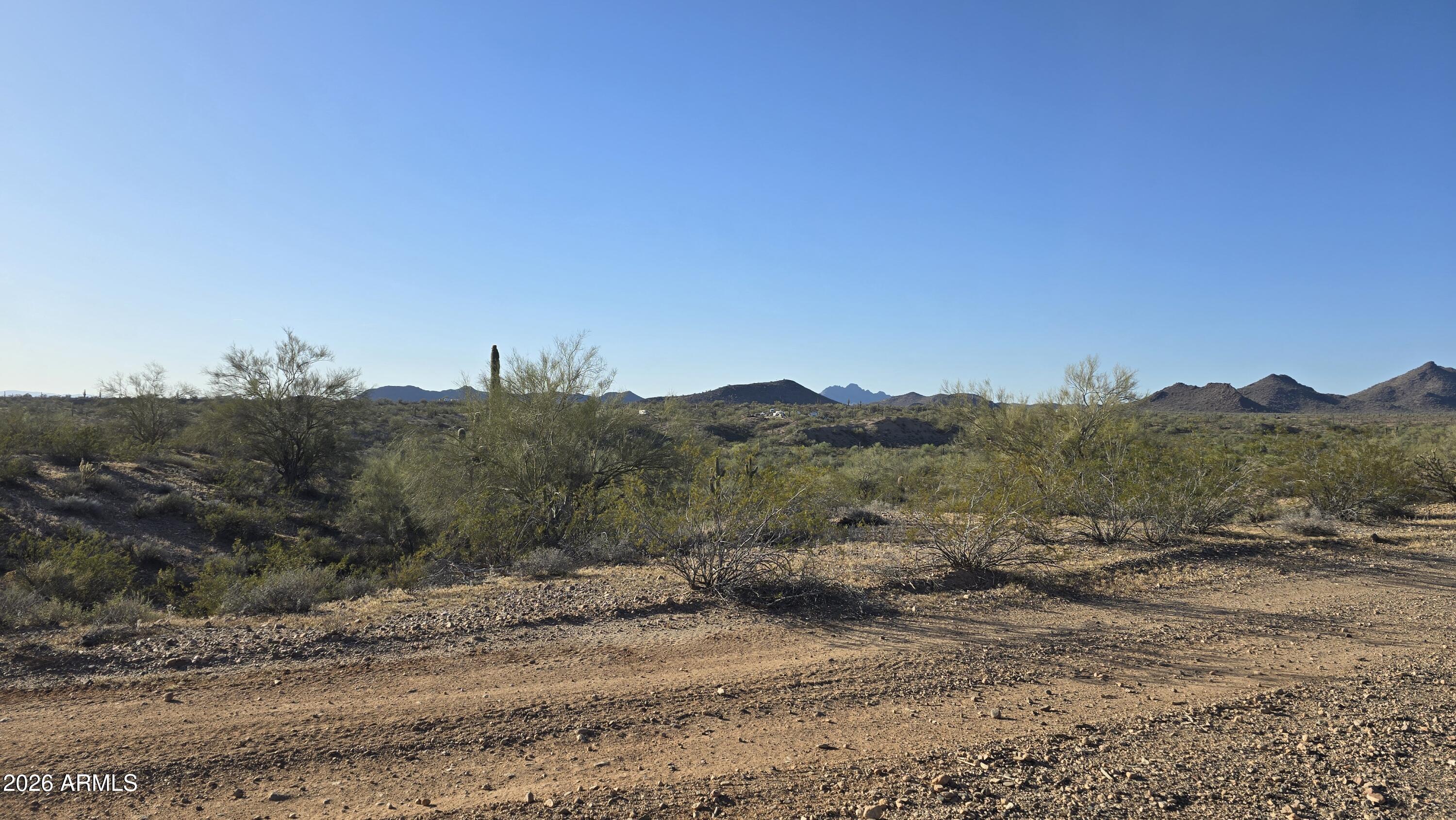 280-xx West Dove Valley Road, Unit 6 PARCELS Wittmann, AZ 85361 - Photo 11 of 25 a view of a road with a mountain in the background