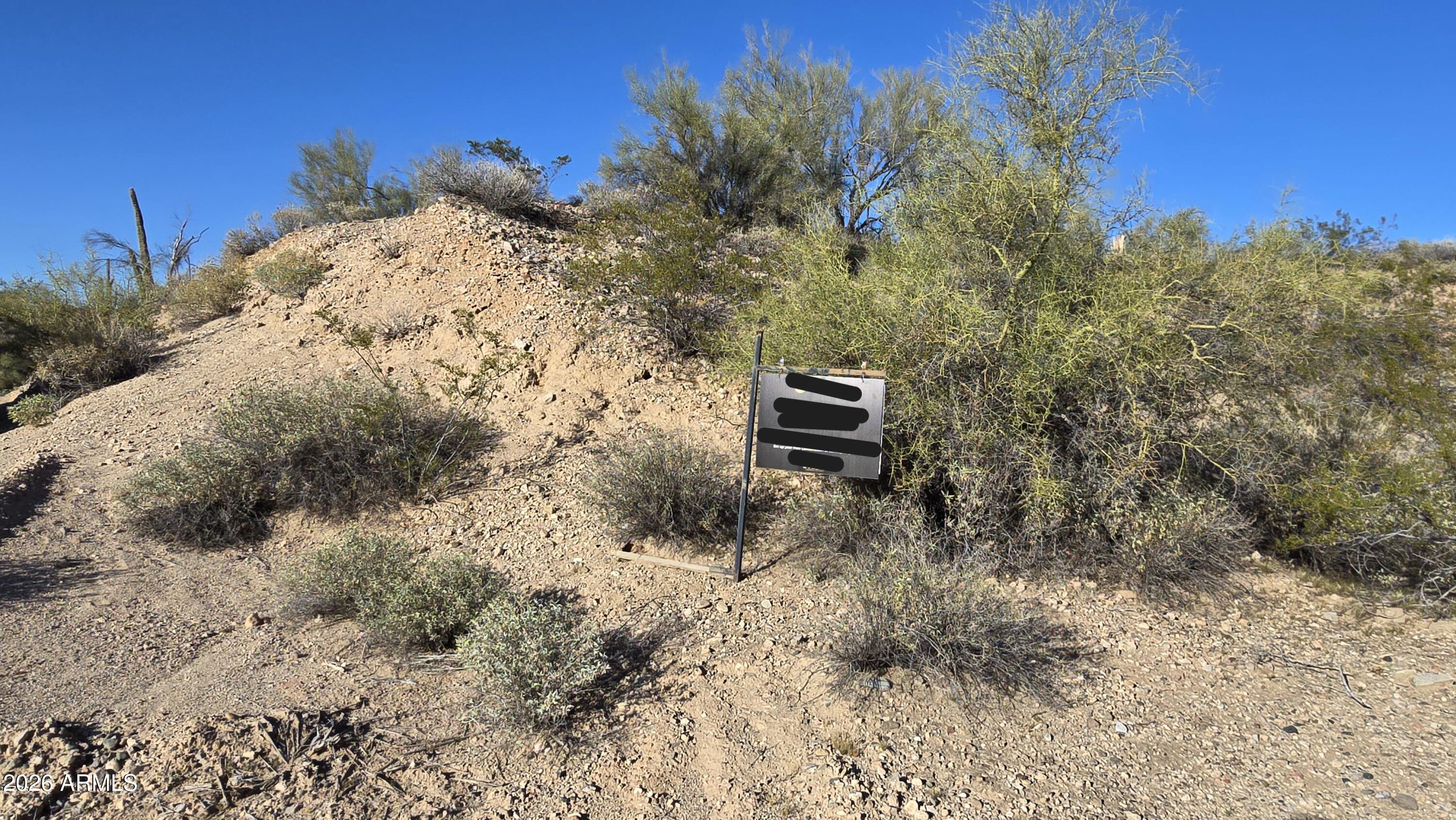 280-xx West Dove Valley Road, Unit 6 PARCELS Wittmann, AZ 85361 - Photo 25 of 25 a view of a dry yard with trees