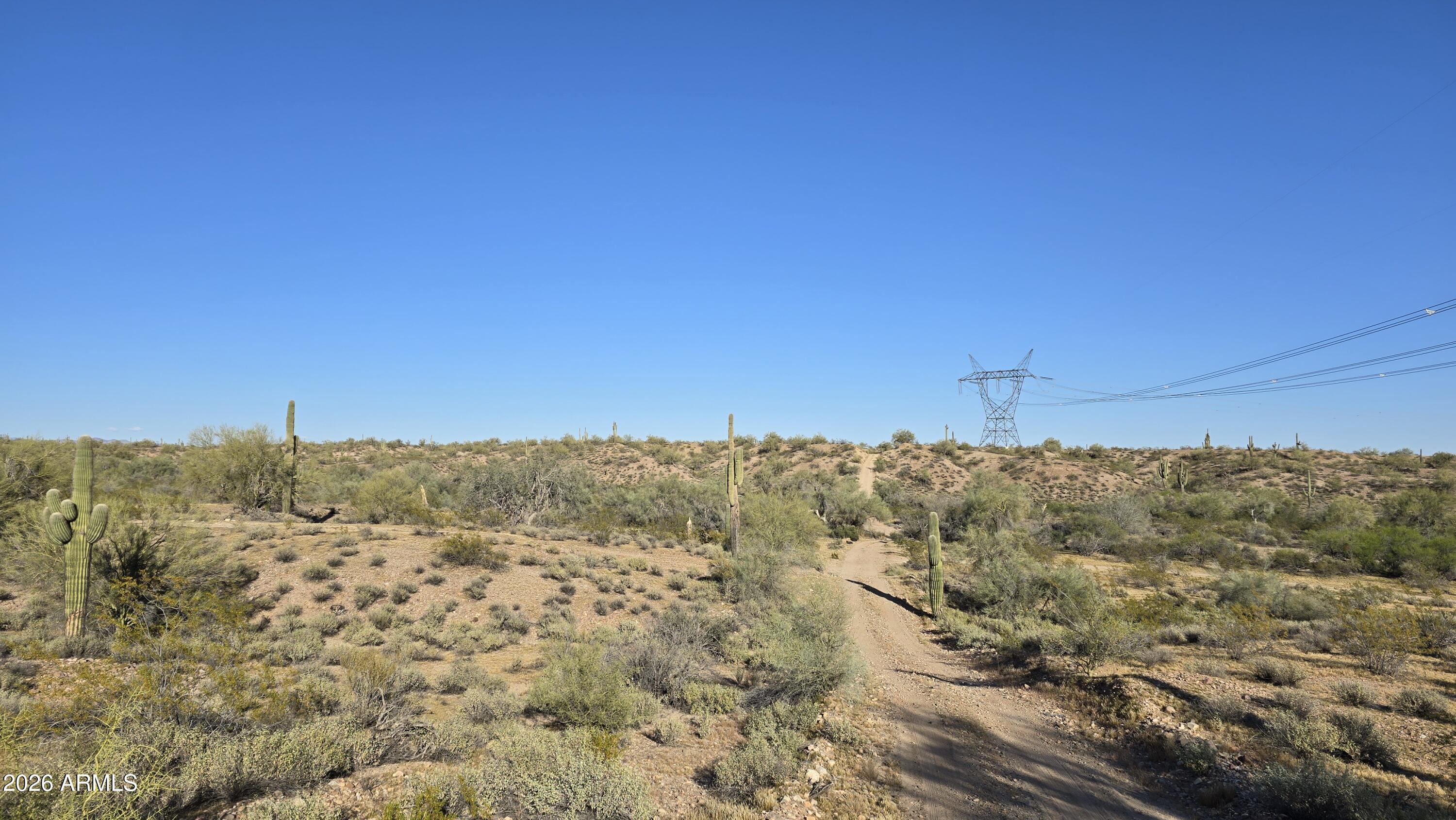 280-xx West Dove Valley Road, Unit 6 PARCELS Wittmann, AZ 85361 - Photo 8 of 25 a view of a dry yard with mountains in the background