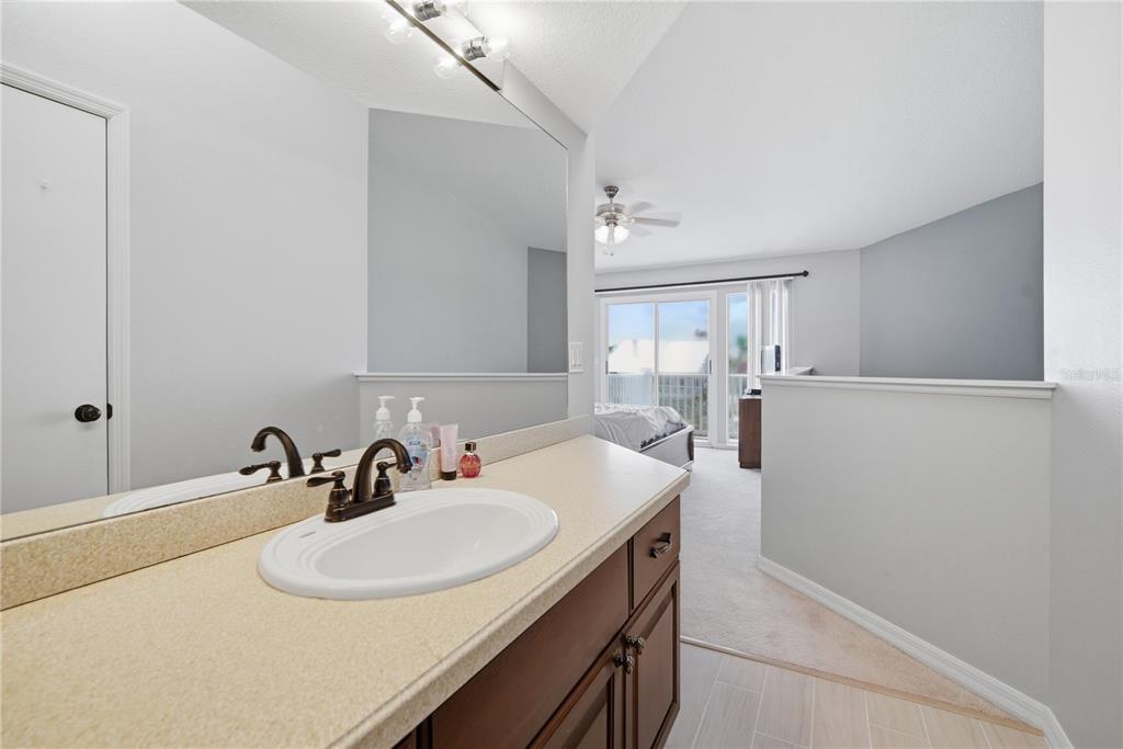 643 Garland Circle Indian Rocks Beach, FL 33785 - Photo 40 of 81 a bathroom with a sink and a mirror