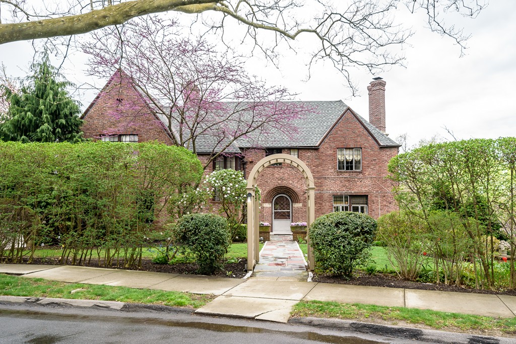 9 Penniman Road Brookline, MA 02445 - Photo 15 of 17 a front view of a house with a yard and garage