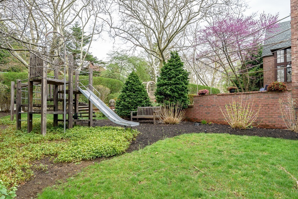 9 Penniman Road Brookline, MA 02445 - Photo 16 of 17 a view of a house with a yard and trees