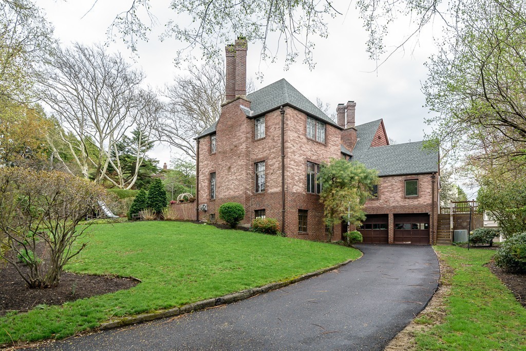 9 Penniman Road Brookline, MA 02445 - Photo 17 of 17 a front view of a house with a garden and trees