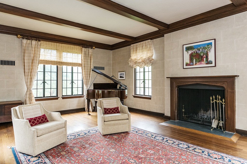 9 Penniman Road Brookline, MA 02445 - Photo 2 of 17 a living room with furniture and a fireplace