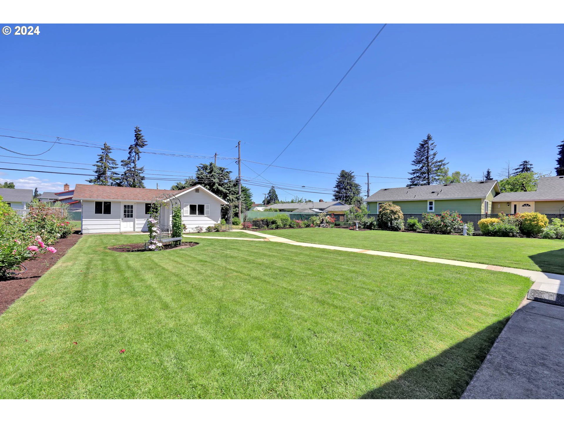 2411 15th Street Springfield, OR 97477 - Photo 14 of 18 a front view of a house with garden