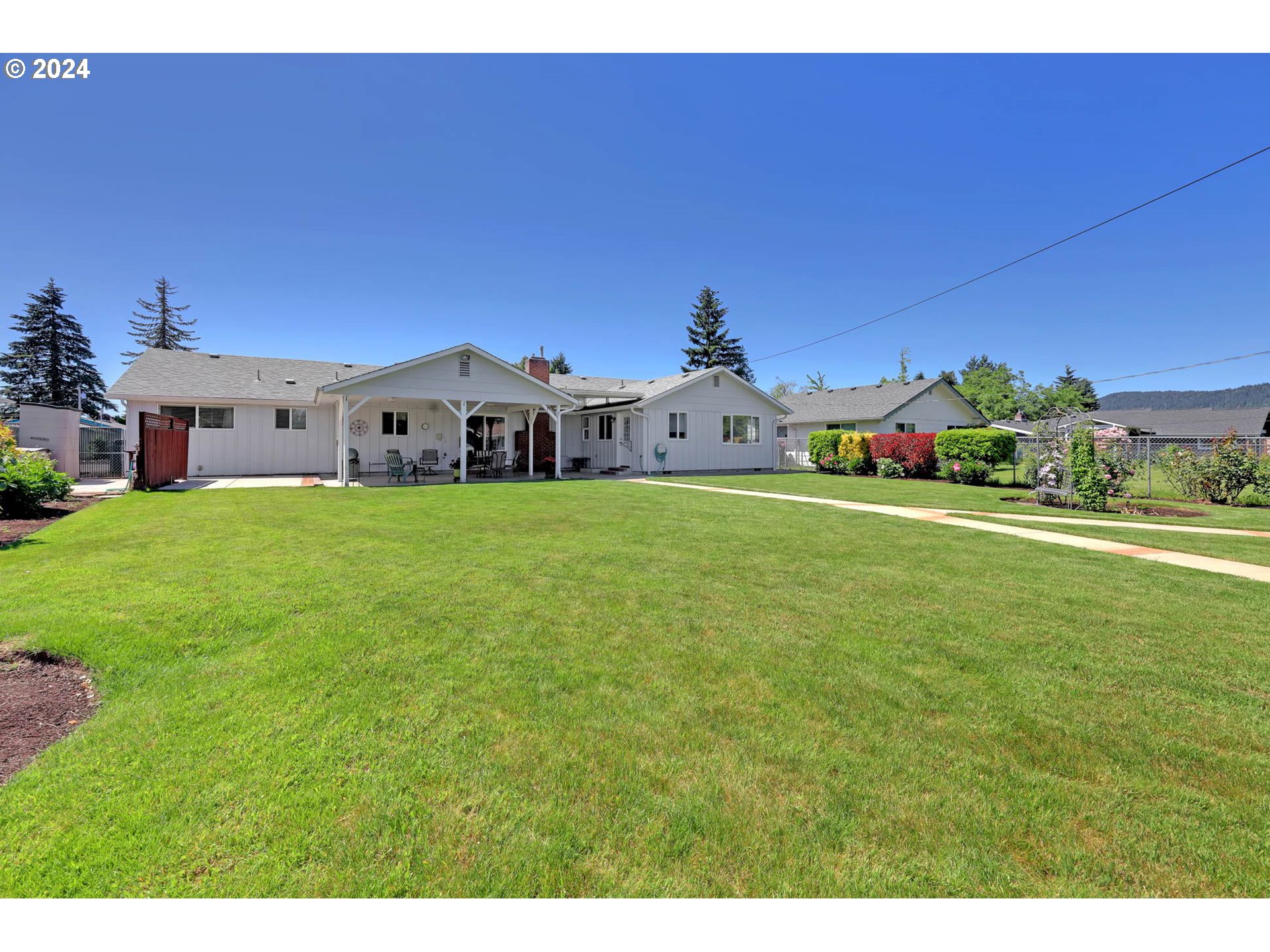 2411 15th Street Springfield, OR 97477 - Photo 15 of 18 a view of a house with a yard and sitting area