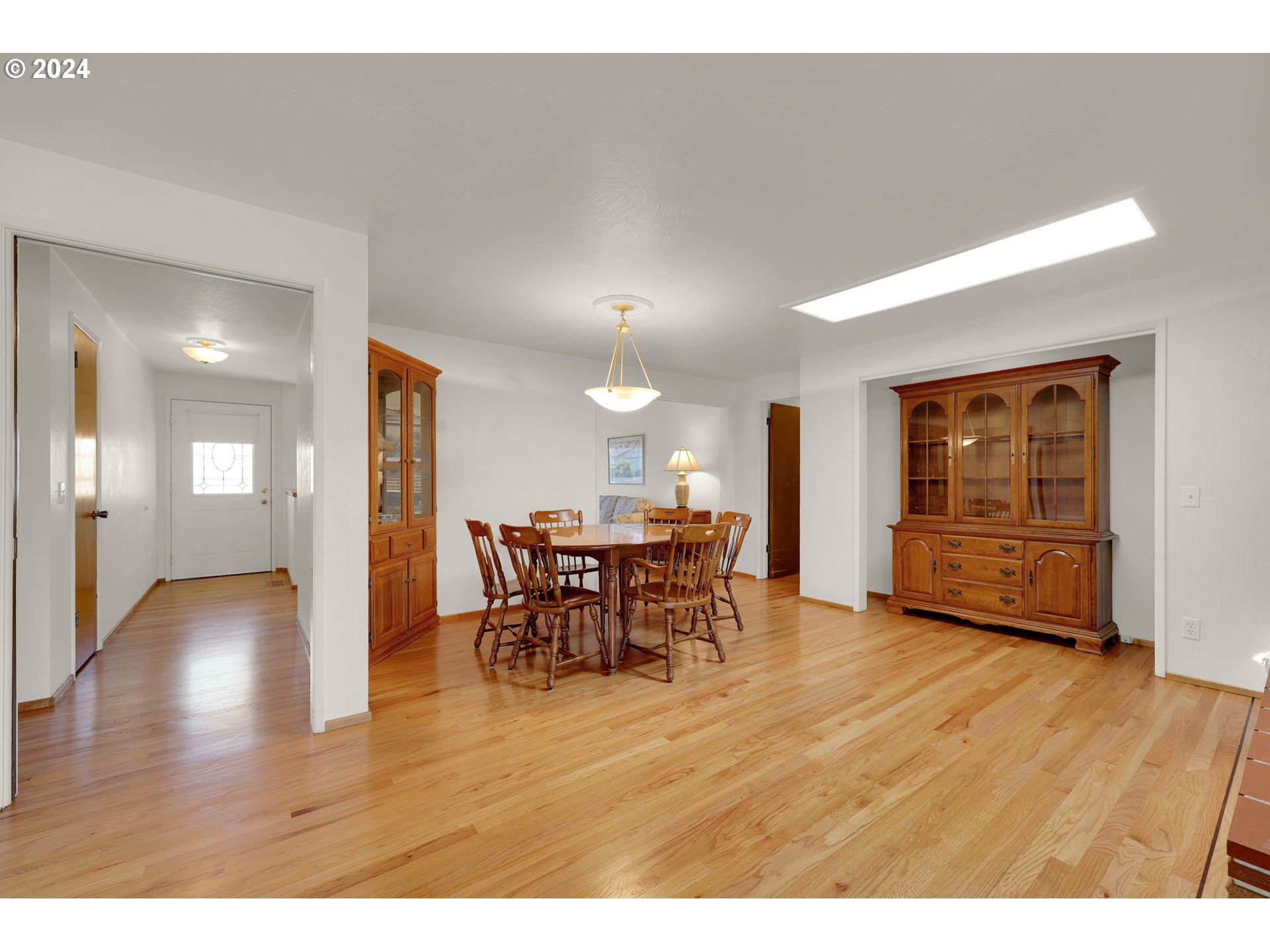 2411 15th Street Springfield, OR 97477 - Photo 4 of 18 a dining room with furniture and wooden floor