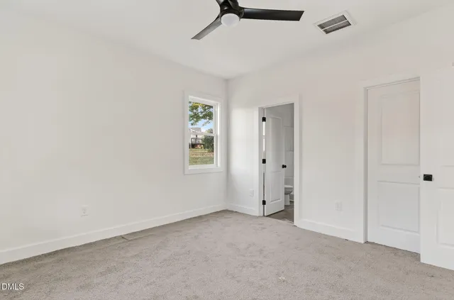a bathroom with double sink and a mirror