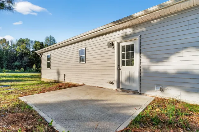 a view of a backyard of the house
