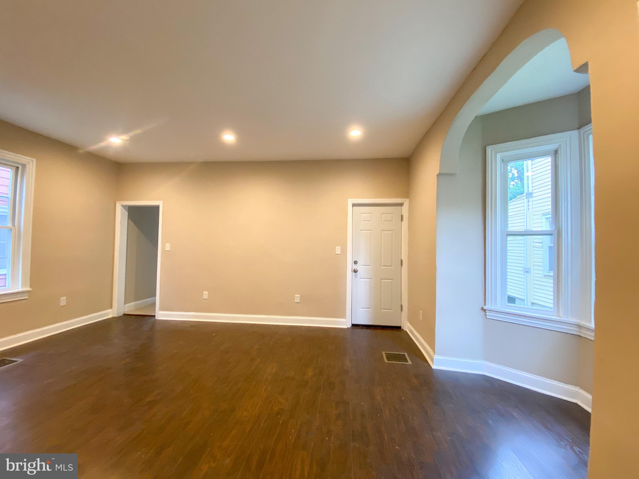 40 High Street Woodbury, NJ 08096 - Photo 1 of 13 Livingroom and Dining Combo with entrance to deck