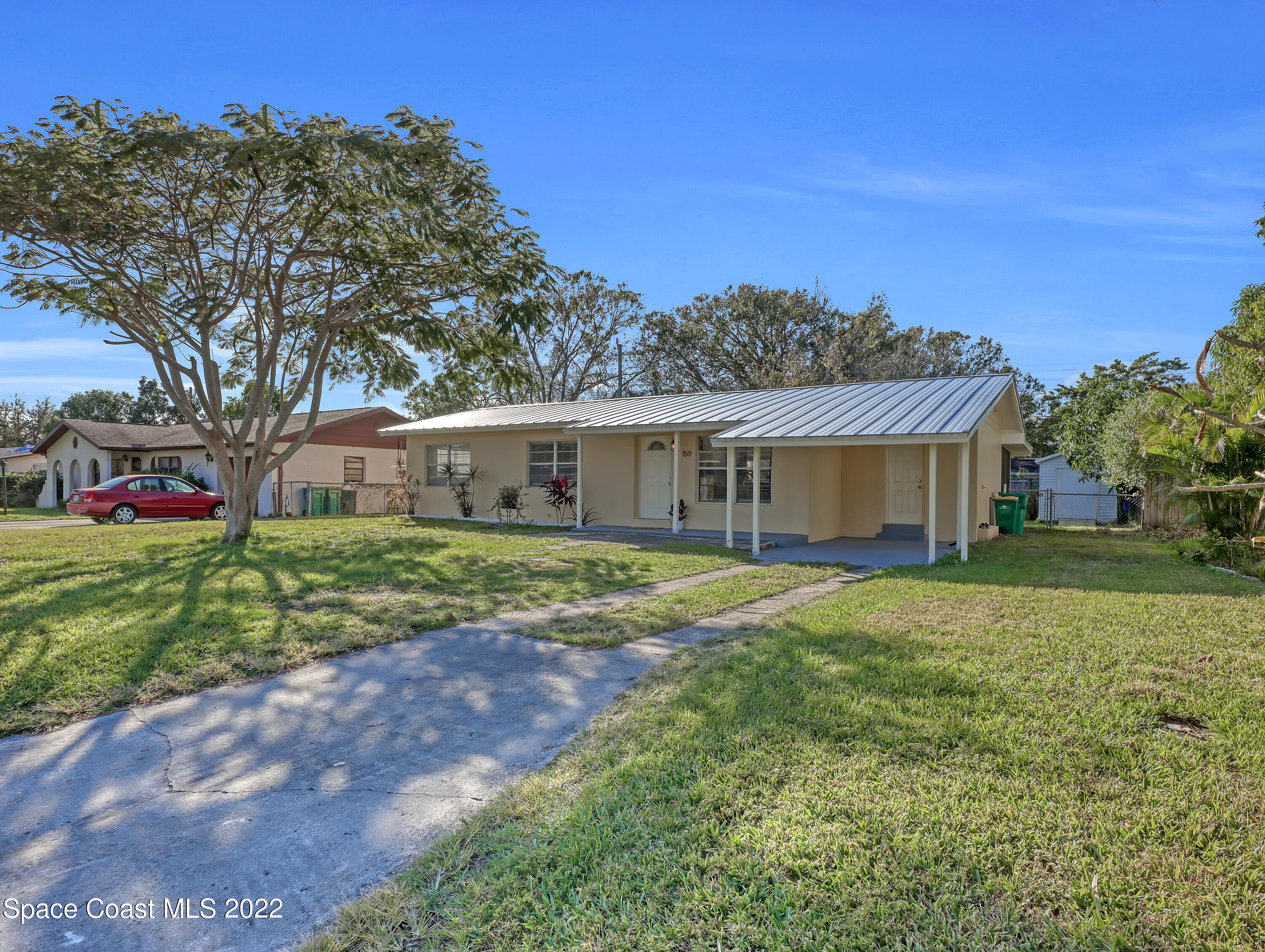 159 Monaco Road Melbourne, FL 32904 - Photo 4 of 31 a front view of house with yard and green space