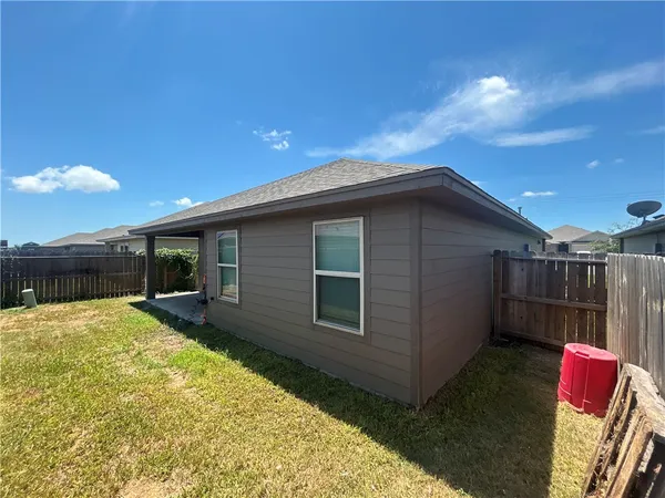 a house view with a backyard space